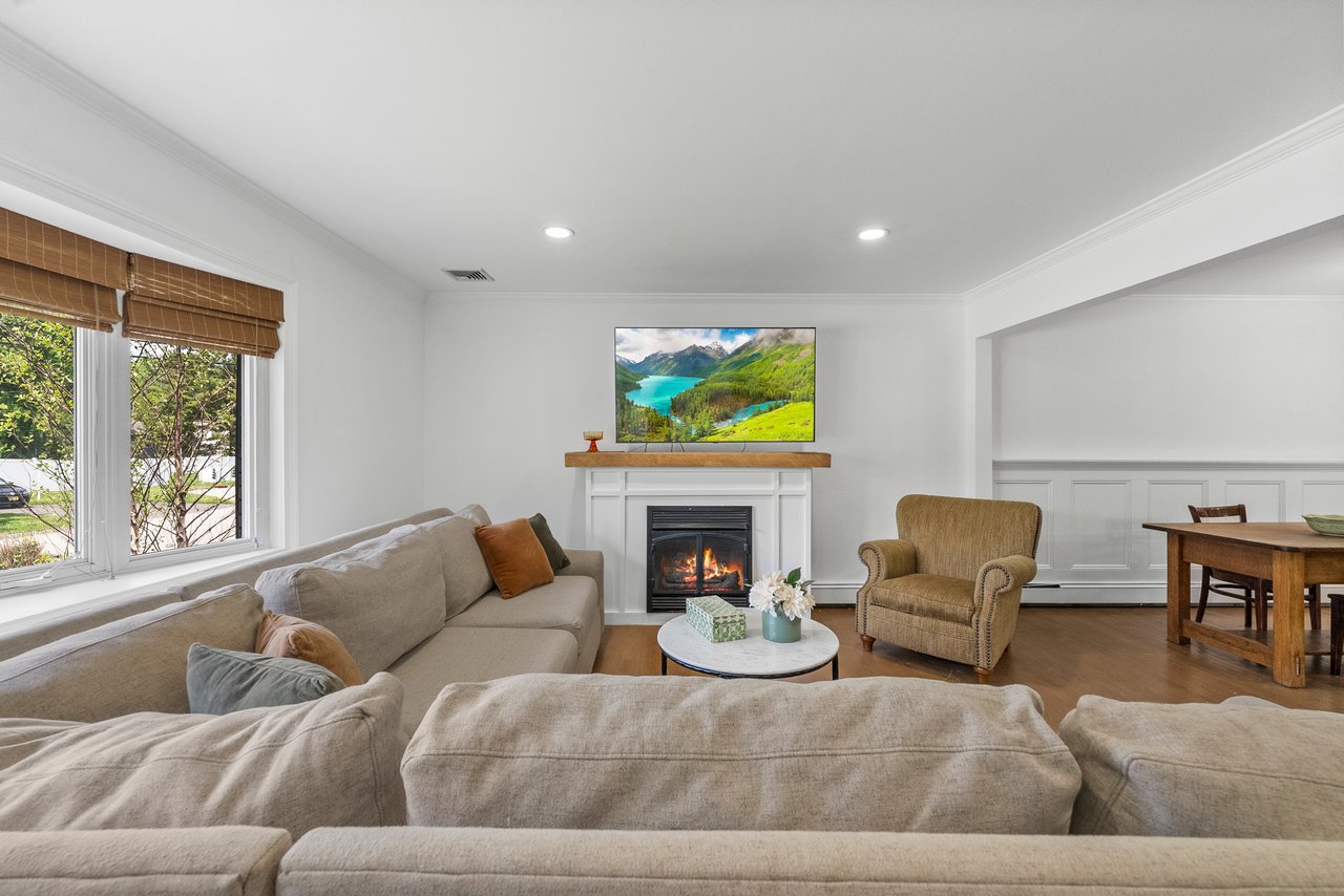 Modern living room interior with fireplace, representing luxury real estate in the Northern Valley region of NJ.