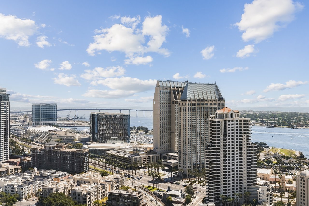 Downtown San Diego skyline and bay, with the Coronado Bridge in the distance.