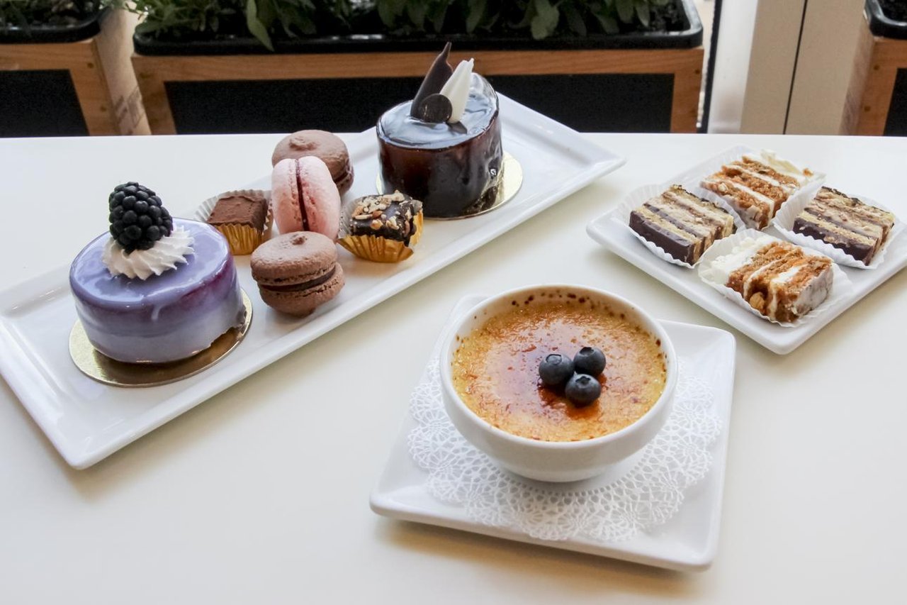 Fresh French pastries, cakes, and desserts displayed at Cassis Bakery in downtown St. Petersburg, Florida.
