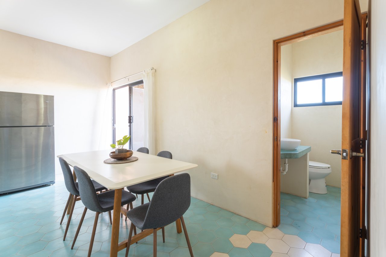 Main studio dining area with half bath at The Studio House in Villas de Cerritos, featuring open layout in Cerritos, Baja California Sur.
