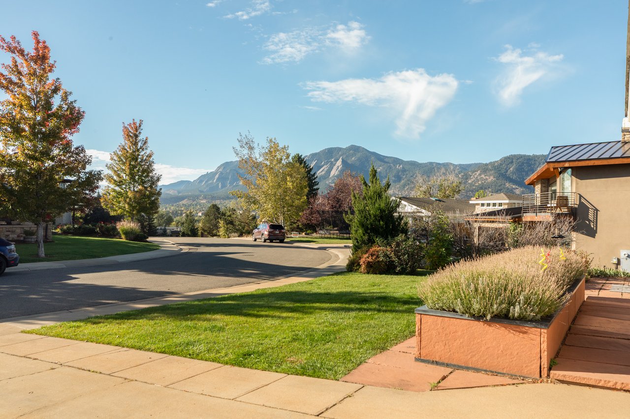 Front yard and raised planter beds at 2003 Balsam Drive looking south toward the Flatirons