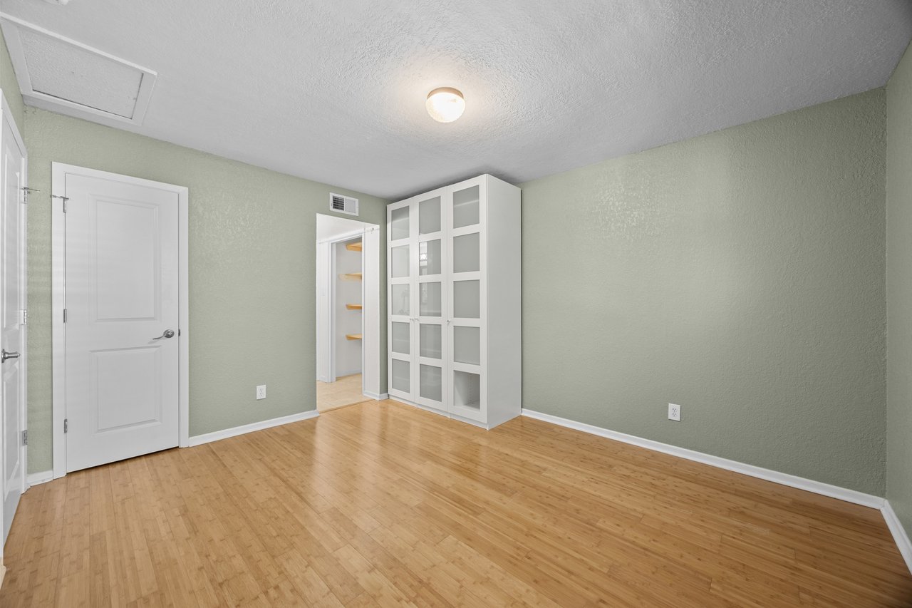 Top-Floor Condo Retreat in Gated Ivy Condos | Private Balcony + Tree-Filled Views