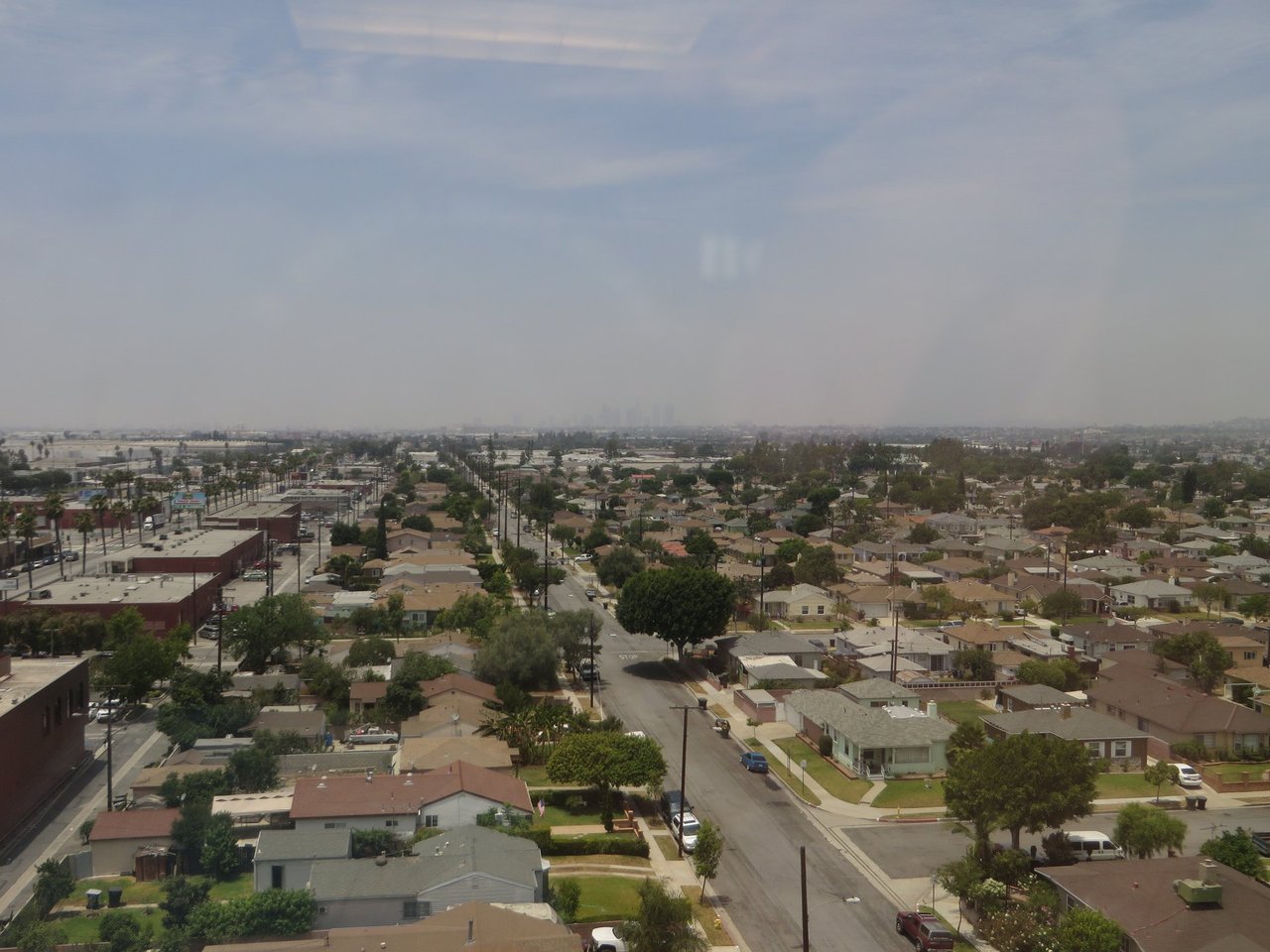Residential rooftops in Commerce with the downtown Los Angeles skyline in the distance, June 2014