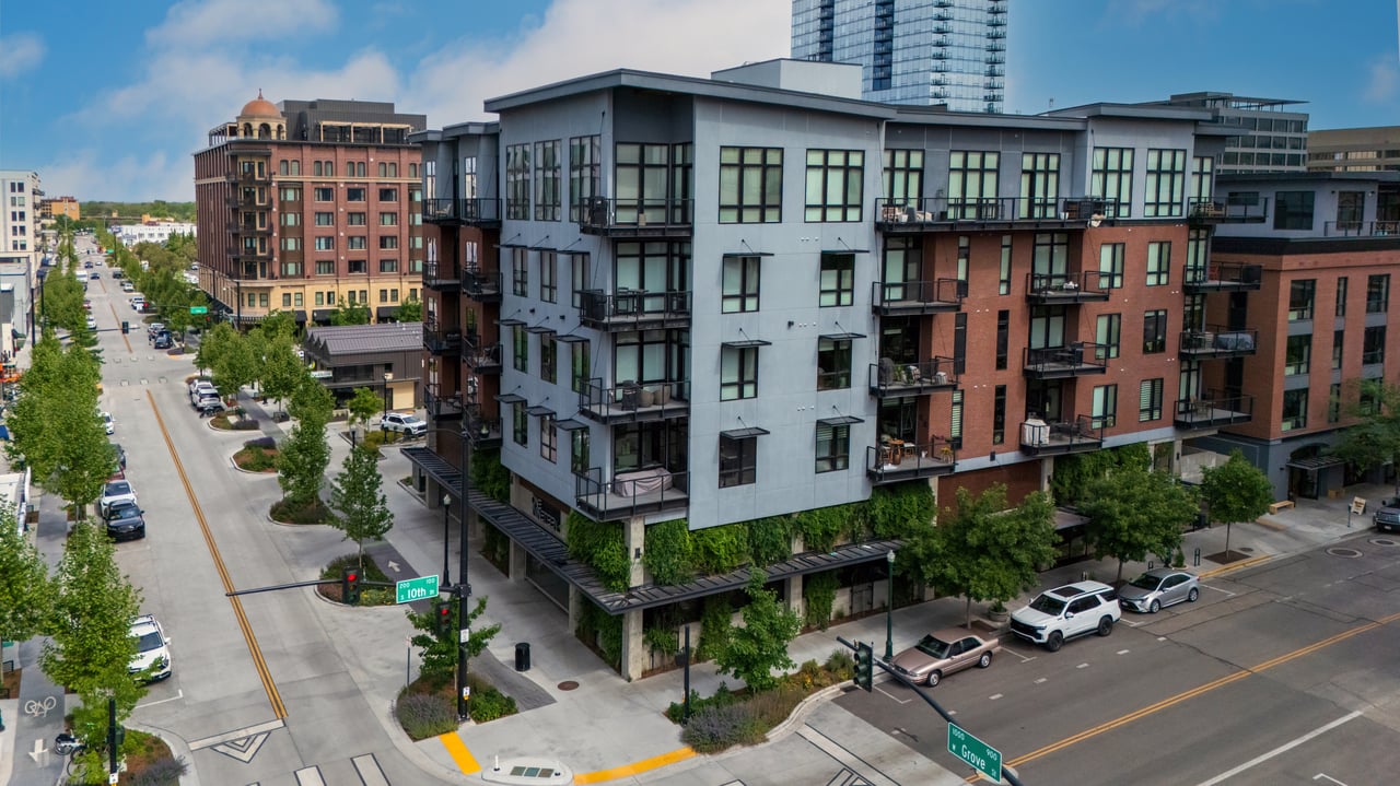 One Nineteen apartment building with balconies at a downtown Boise intersection.
