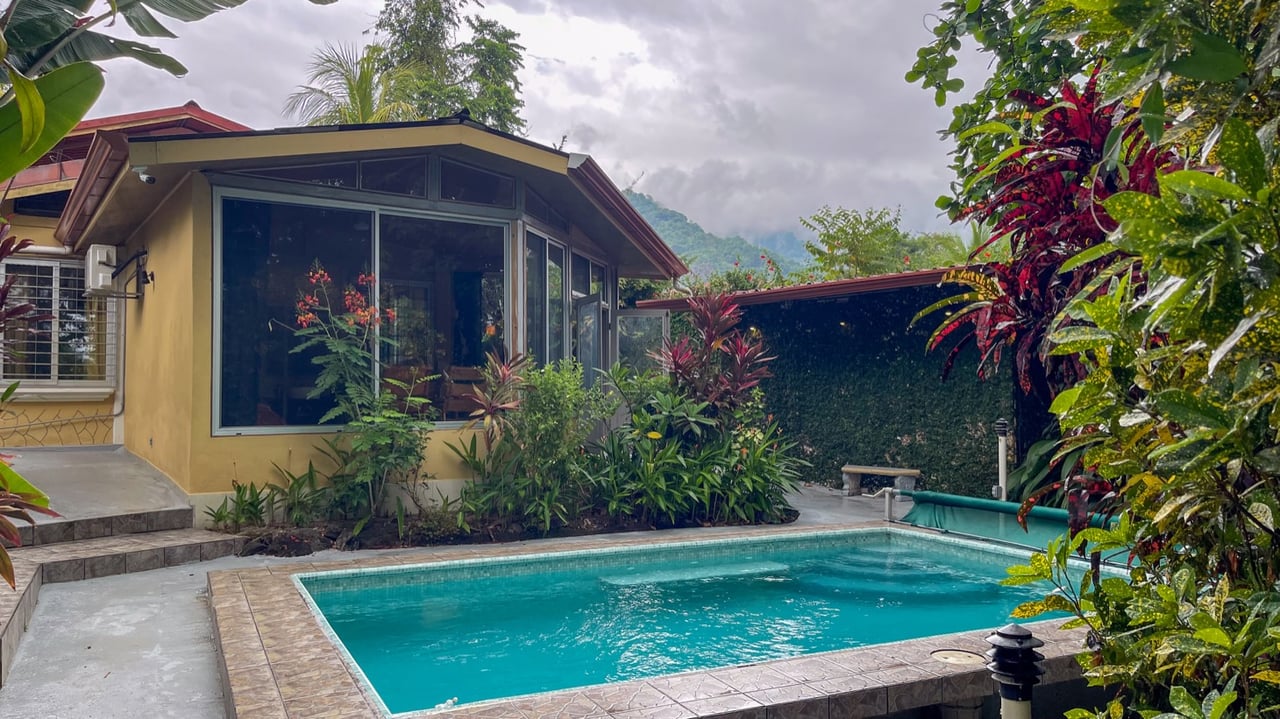 Cozy Colonial Home with Lush Gardens and Prime Commercial Prospects