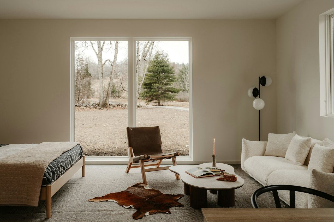 Cute neutral bedroom with a foggy snowless winter view