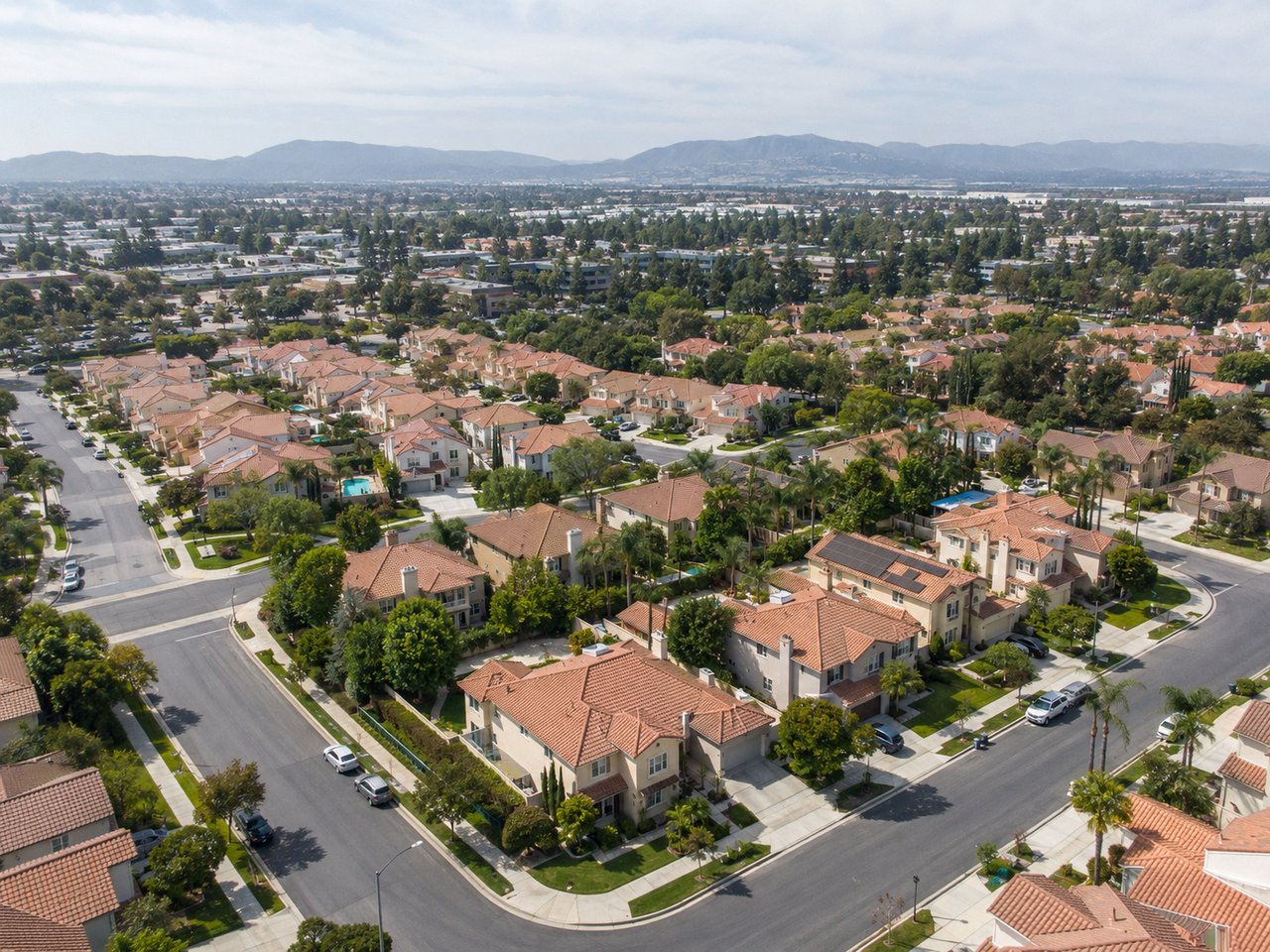 Quiet Irvine residential neighborhood with landscaped homes, tree-lined streets, and a welcoming Southern California community feel.