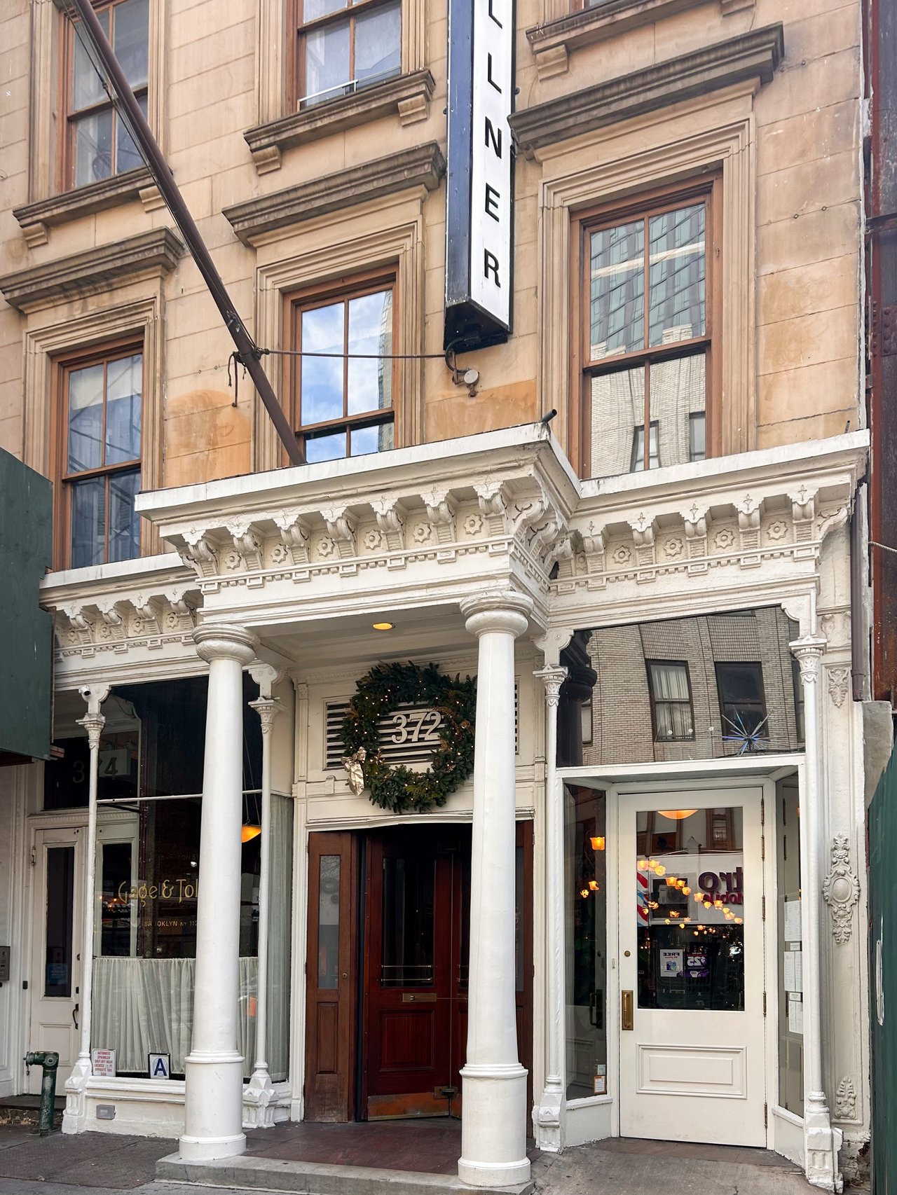 Parents and adult child reviewing a New York City real estate plan together