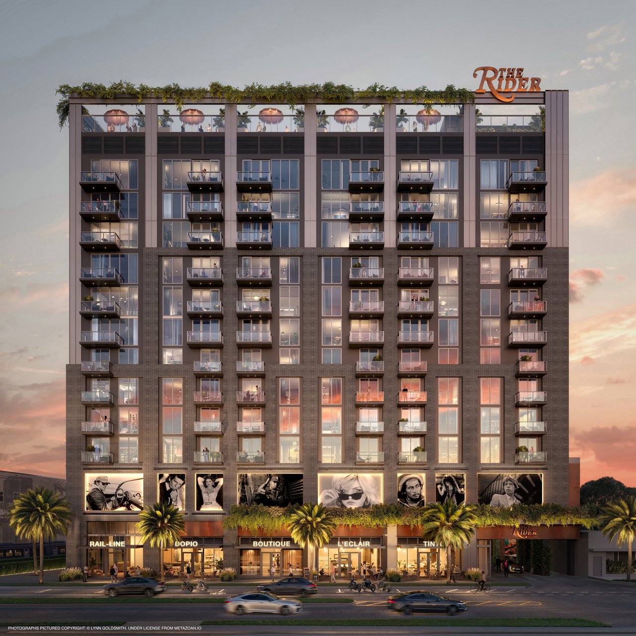 The Rider Residences building with glass balconies, rooftop greenery, and street-level shops at sunset.