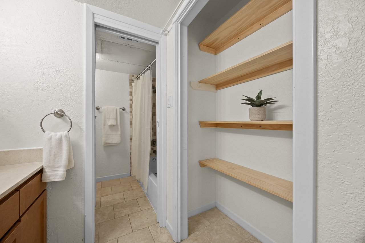 Top-Floor Condo Retreat in Gated Ivy Condos | Private Balcony + Tree-Filled Views