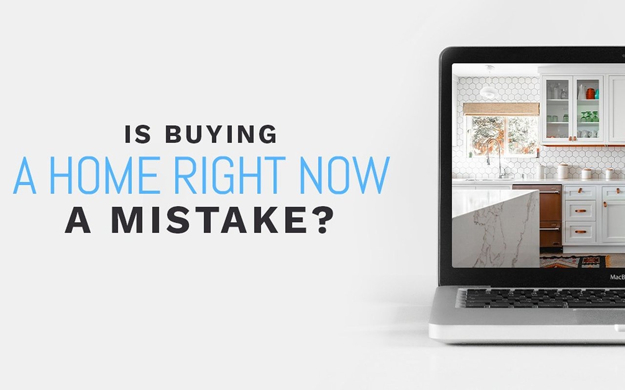 Graphic asking whether buying a home right now is a mistake, beside a laptop showing a white kitchen.