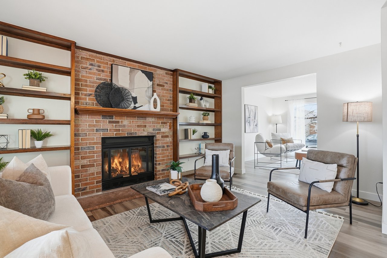 Staged living room in a Denver metro home with fireplace and modern decor, ready for listing and home sale