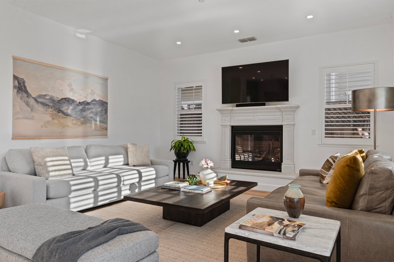 Cozy fireplace-centered living space with classic Craftsman details