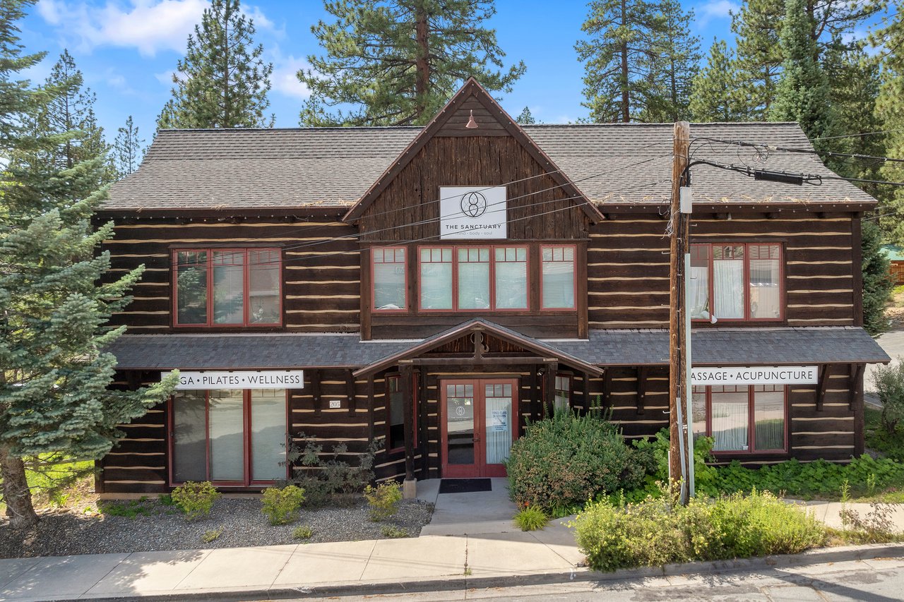 A scenic view of Incline Village, Lake Tahoe, featuring commercial buildings and surrounding natural beauty, showcasing the area's real estate potential.