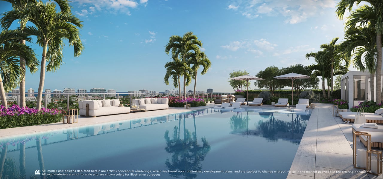 Rooftop pool deck with loungers, palms, and a distant city skyline.