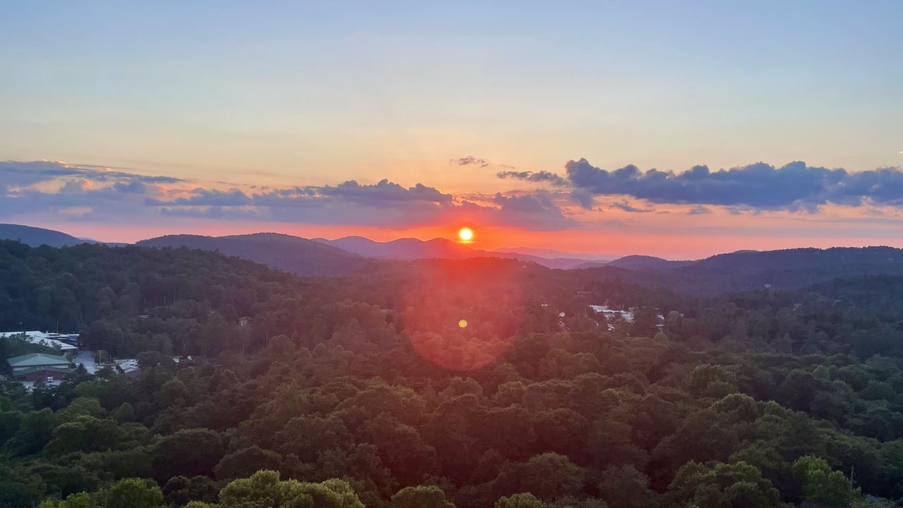 Sunset over the Blue Ridge Mountains and downtown Highlands, NC, seen from Sunset Rock