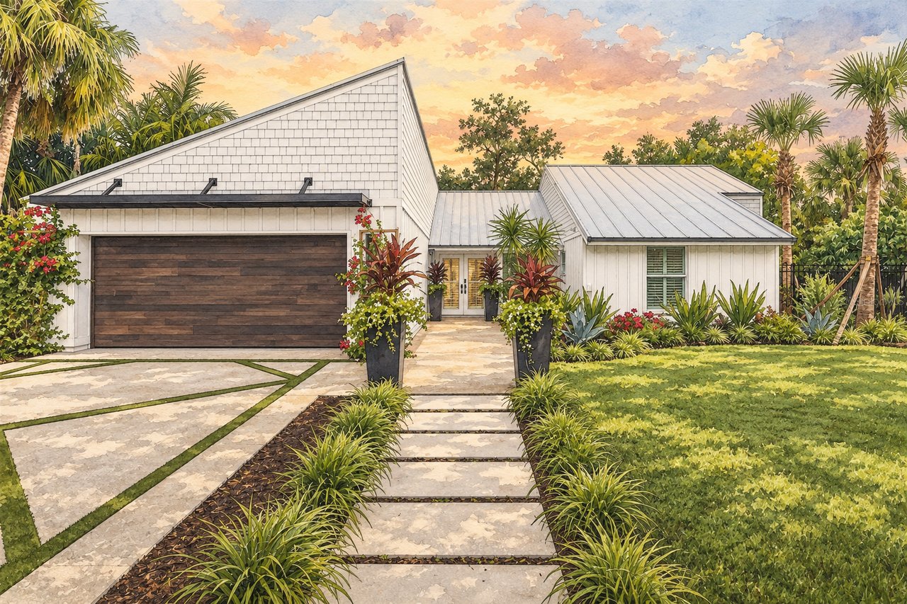 Modern white home with a dark wood garage door, tropical landscaping, and a stone driveway at sunset.