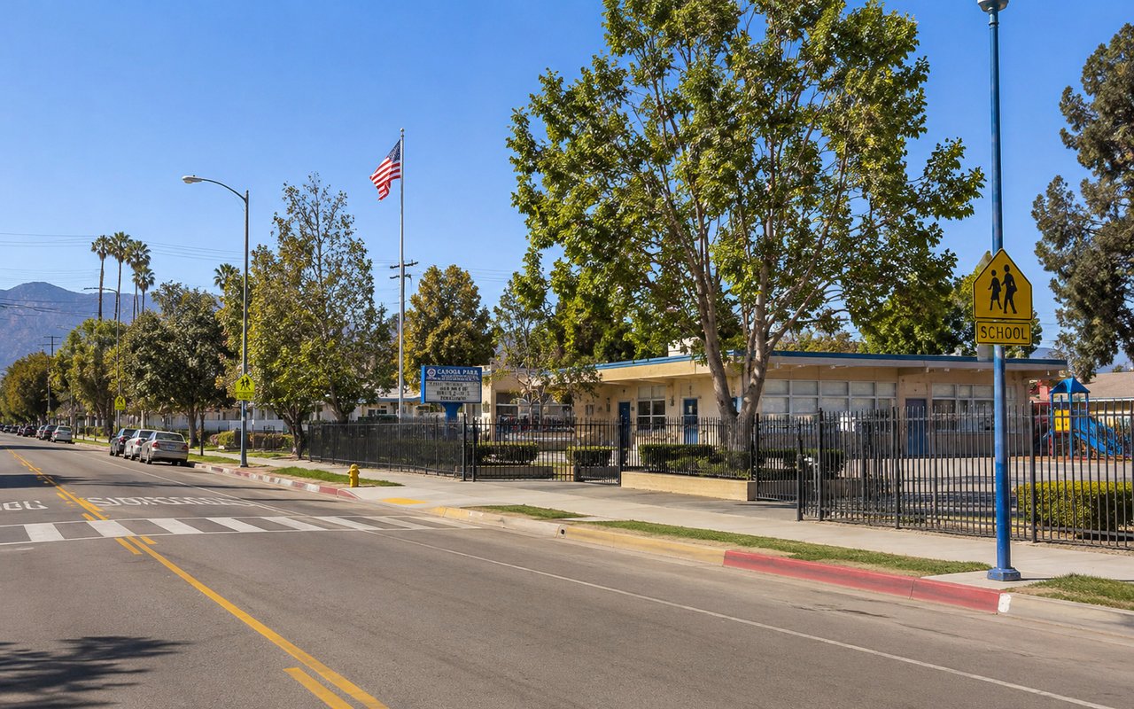 Sunny residential Canoga Park street with modest single-story homes near a neighborhood school