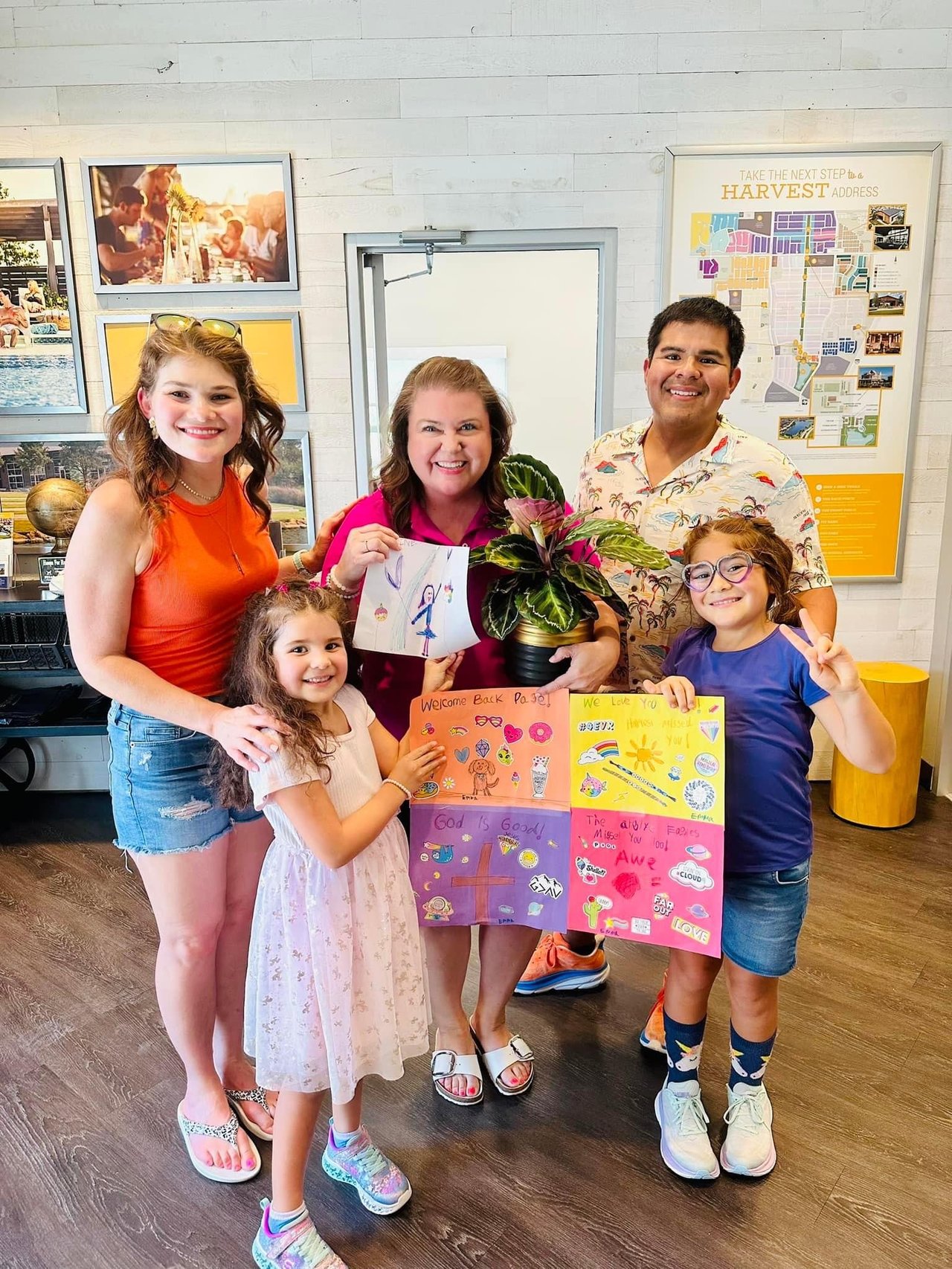 Miranda family with Page Austin Lifestyle Director of Year at Harvest by Hillwood HOA office Argyle Texas lifestyle program headquarters