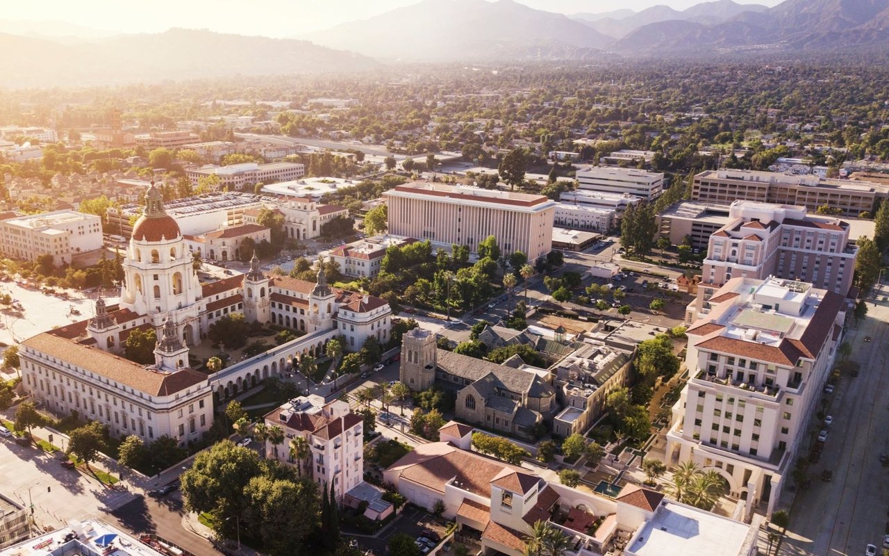 Aerial view of Pasadena City Hall and downtown, with the San Gabriel Mountains in the distance.