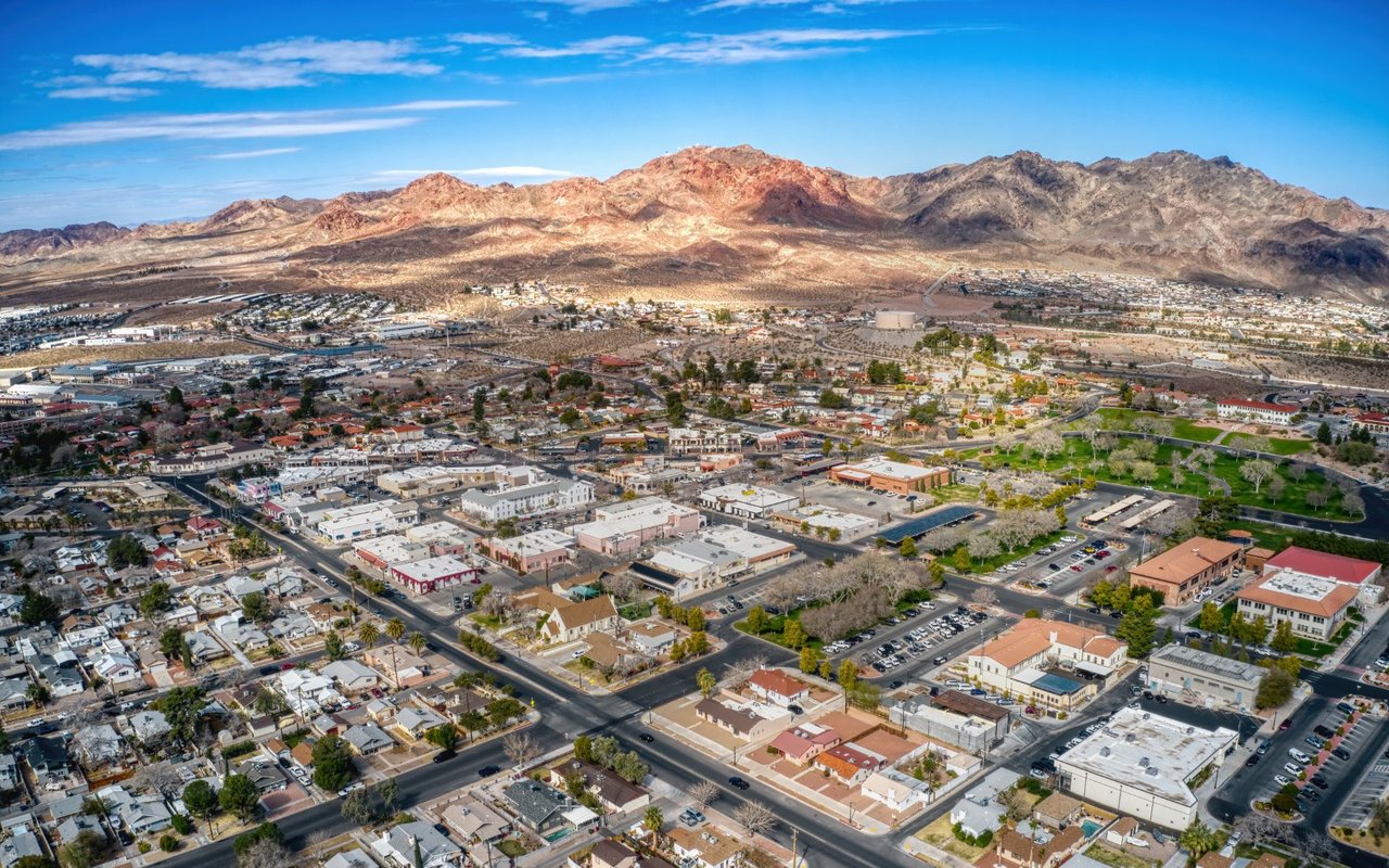 Aerial view of Boulder City’s downtown and surrounding desert mountains.