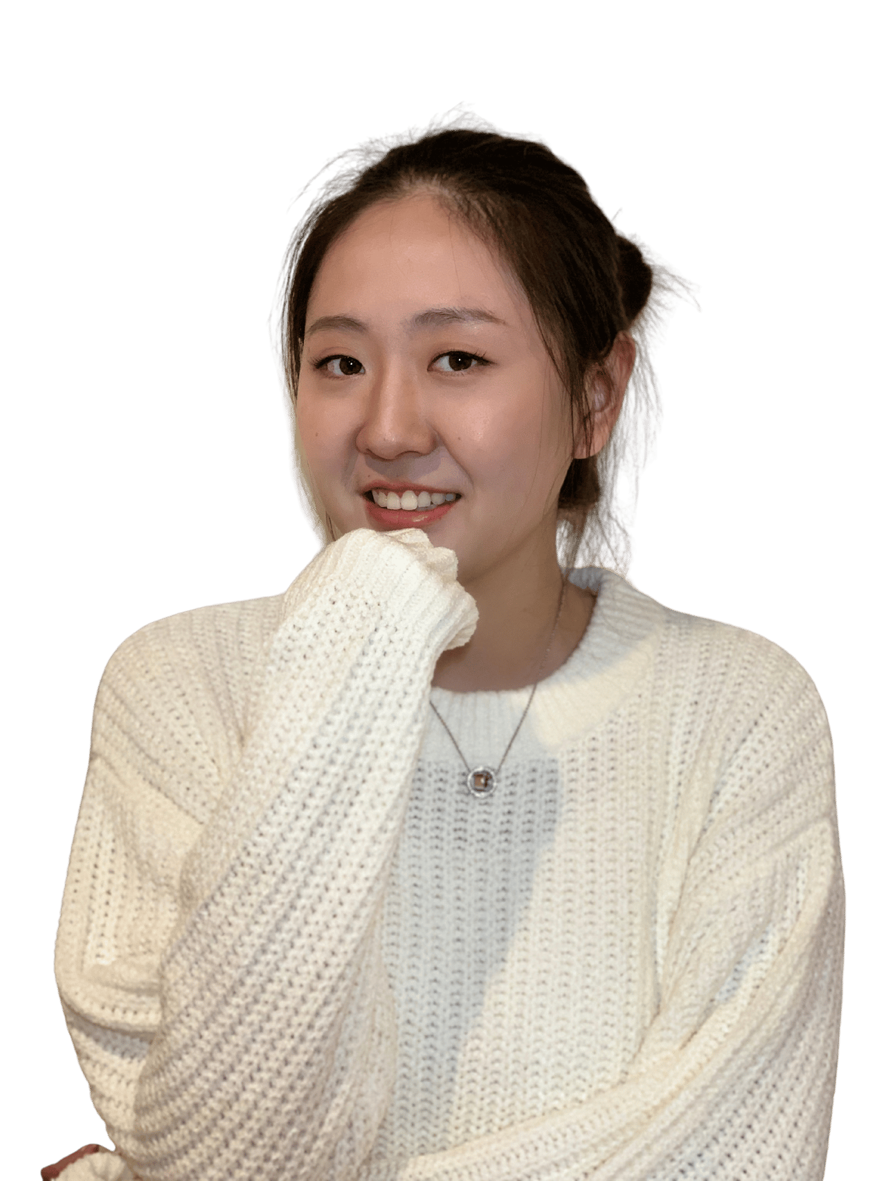 Jessi Li, smiling in a white knit sweater with one hand near her chin.