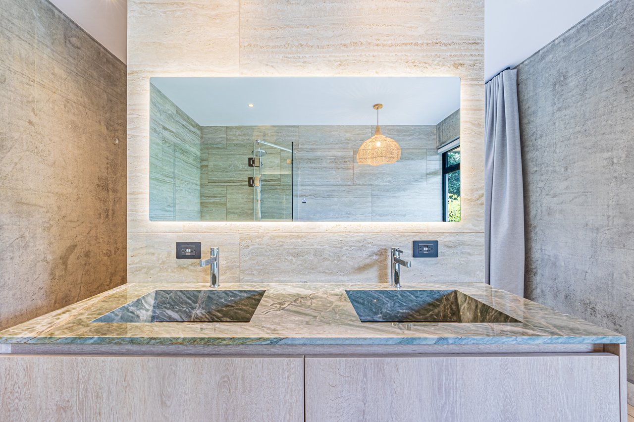 New contemporary tropical villa boasts with a movie theater and views of the iconic whale’s tail