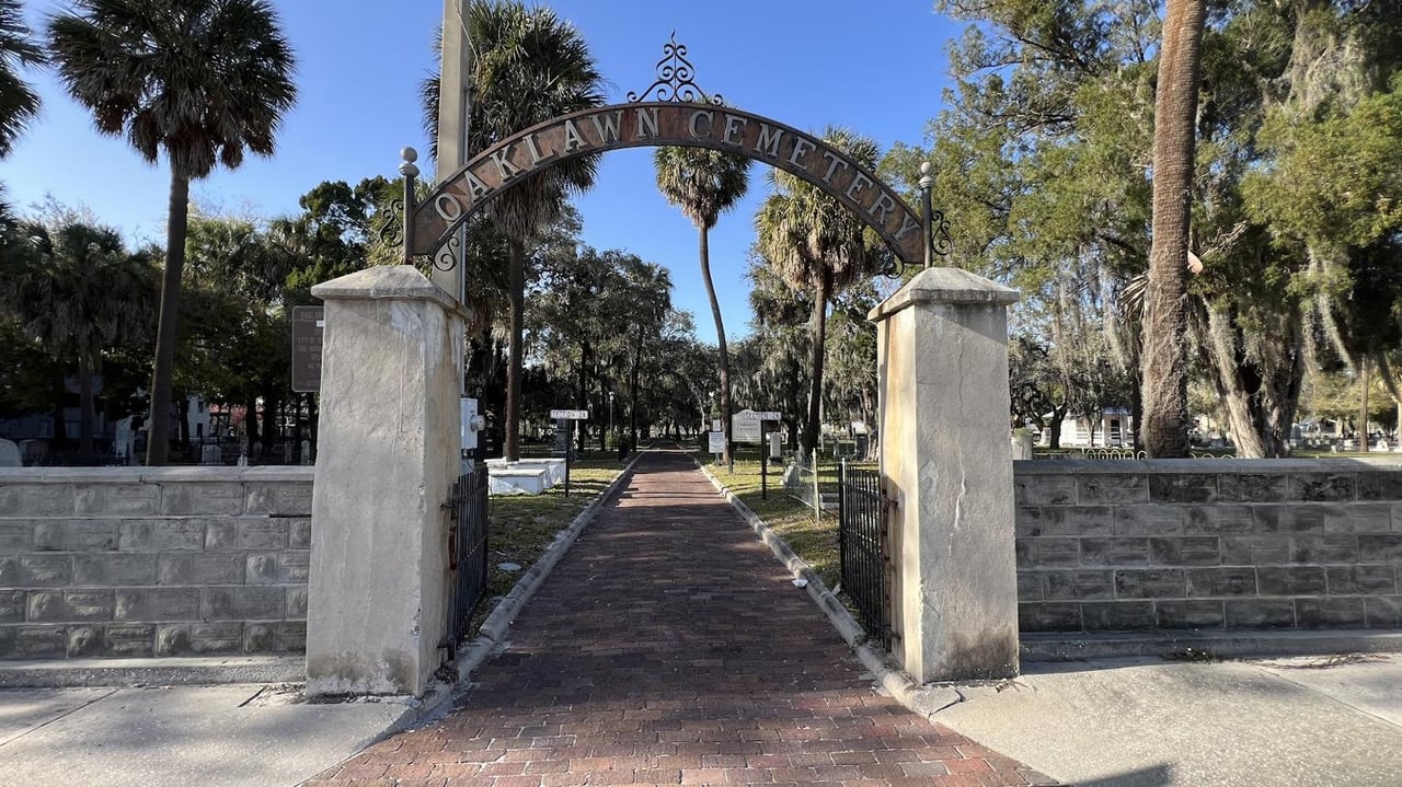 Historic monuments and oak trees at Oaklawn Cemetery in Tampa, Florida, one of the city's oldest cemeteries known for its rich history and local legends