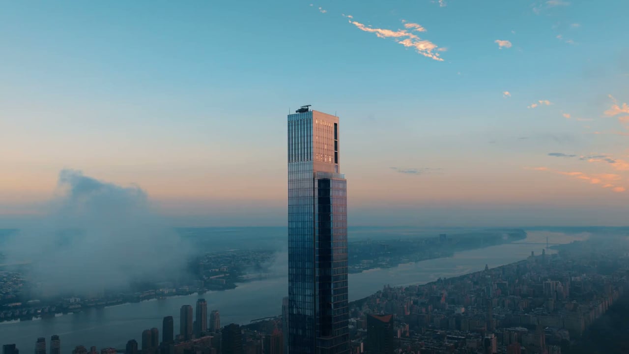 Central Park Tower rises above Manhattan, with the Hudson River and city skyline in the distance.