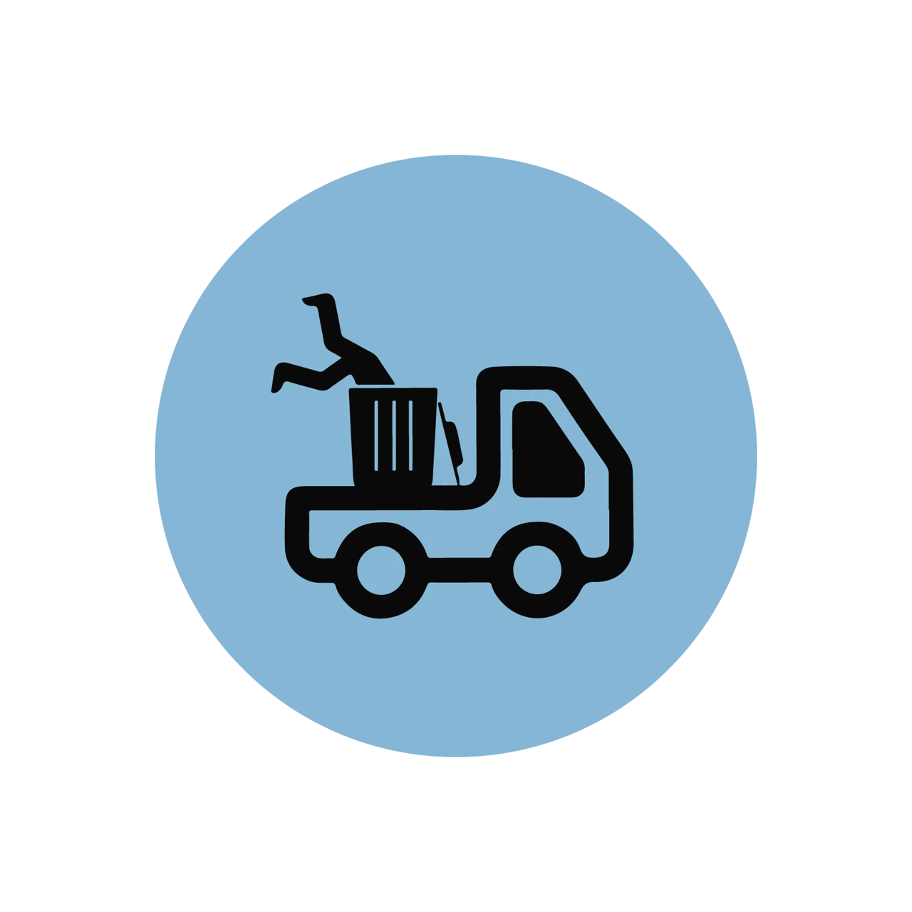 Truck carrying a bin as a person dives into it.