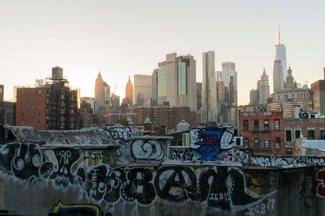 Explore East 1st Street's history, historic tenements, prewar apartment buildings, modern condominiums, cooperative residences, luxury apartments, and evolving architecture in Manhattan's East Village.