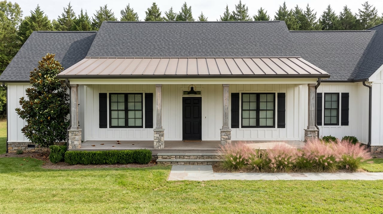 White farmhouse with a full-width porch, stone foundation, and bluestone walk across a green lawn.