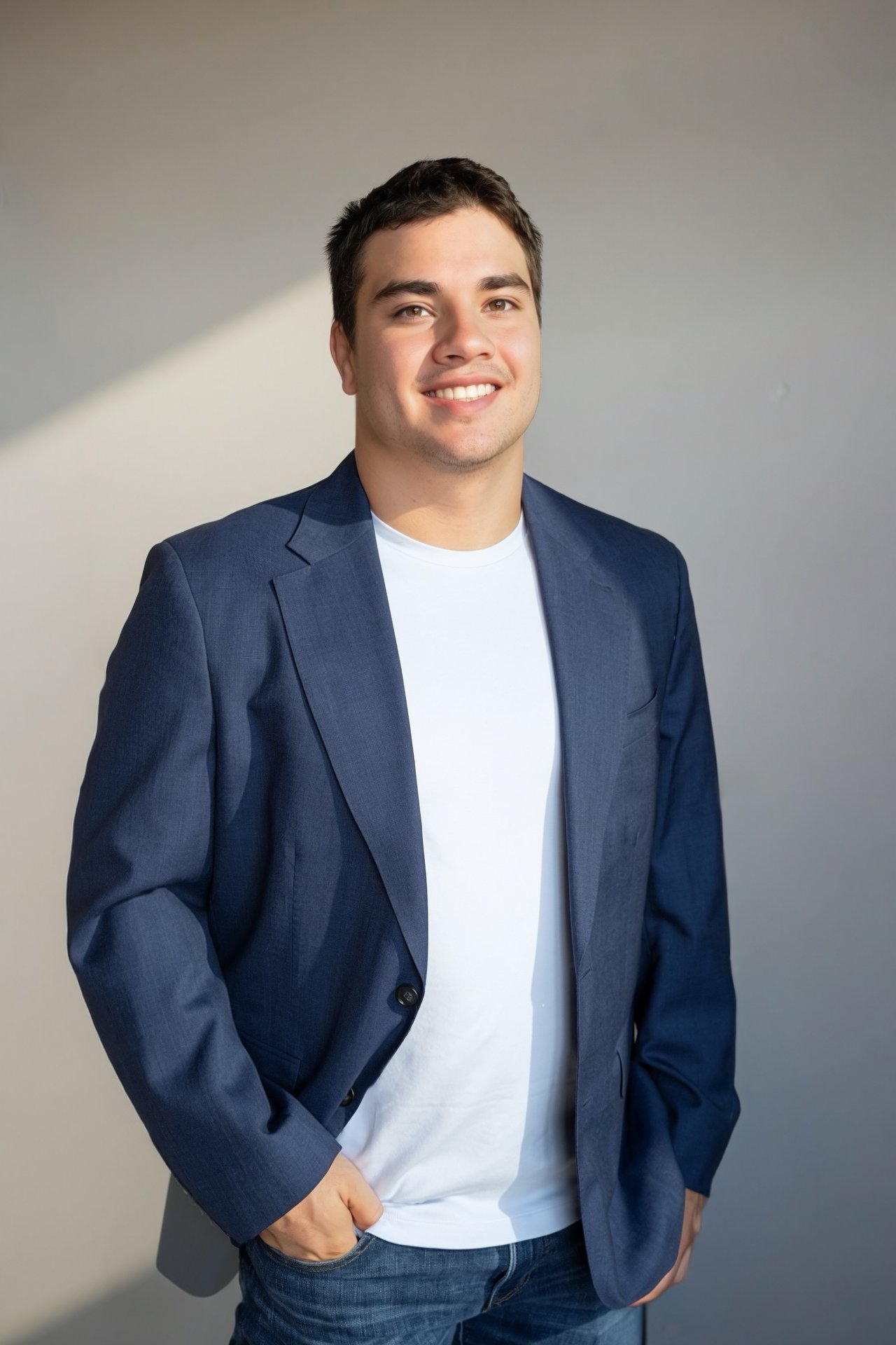 Jaime Careaga smiling in a navy blazer and white shirt.