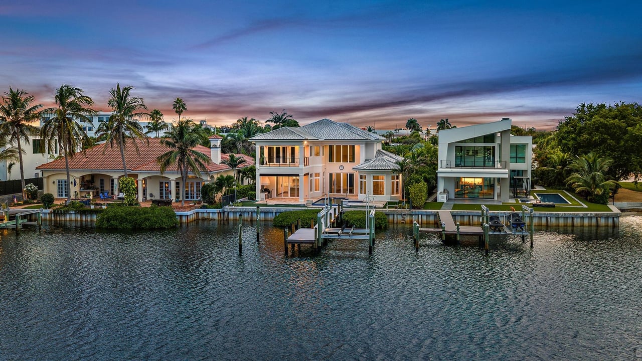 Private dock with a boat lift overlooking wide Intracoastal water at a luxury waterfront home in Jupiter, Florida