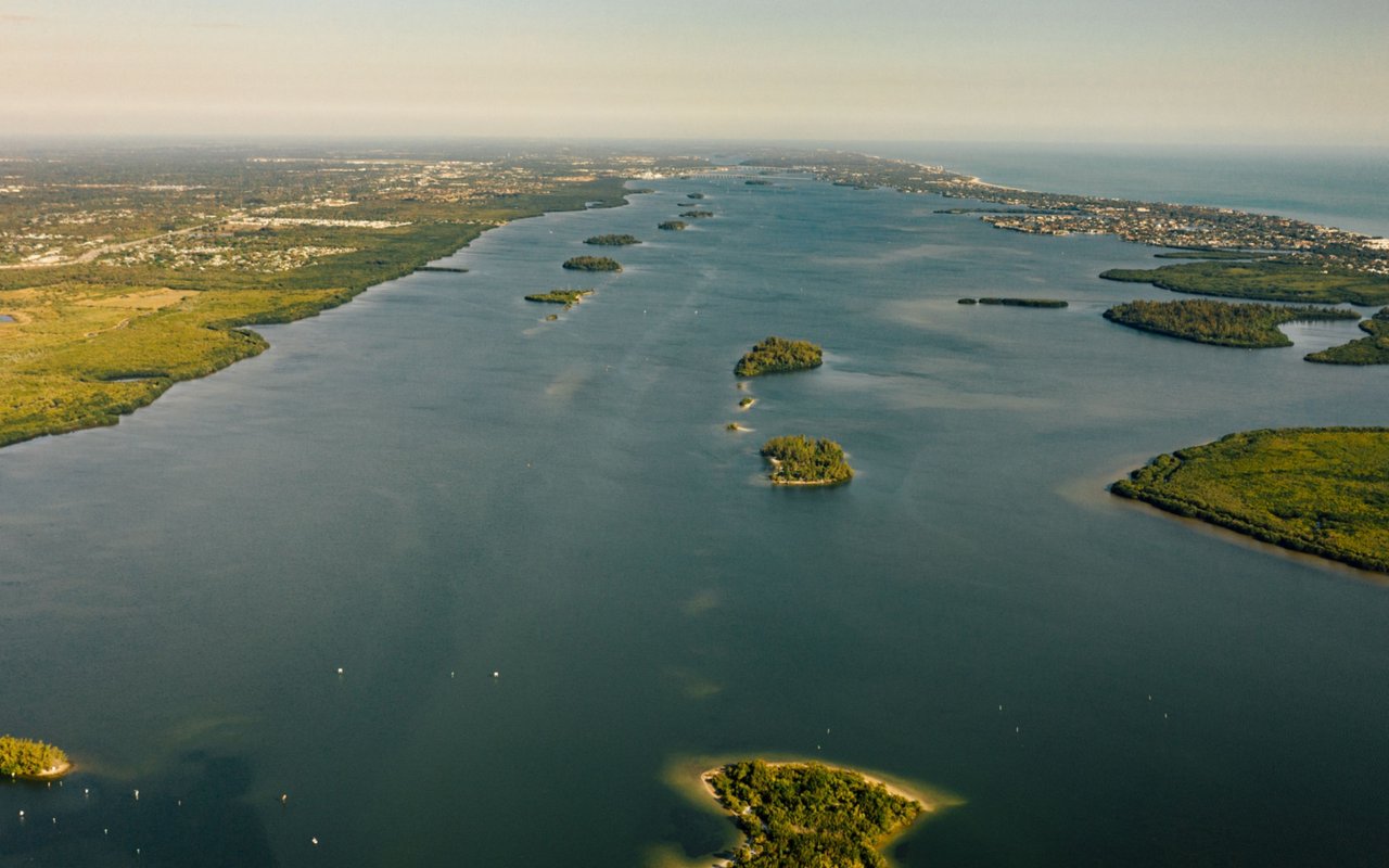 Aerial view of a lagoon near Fort Pierce, with small green islands and mangrove-lined shores.