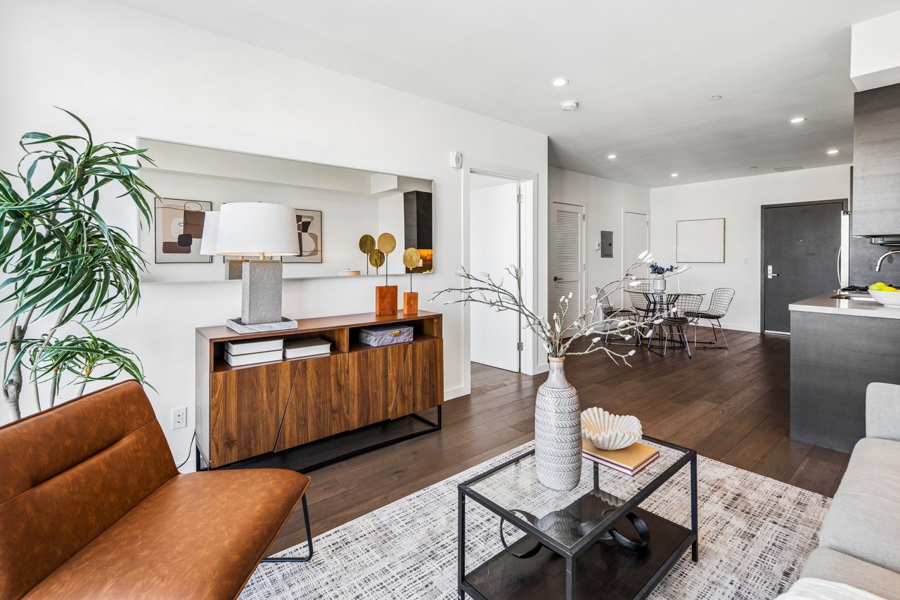 Open-concept living and dining area with clean modern lines, creating a spacious and inviting environment ideal for entertaining or everyday comfort in the heart of SoMa.
