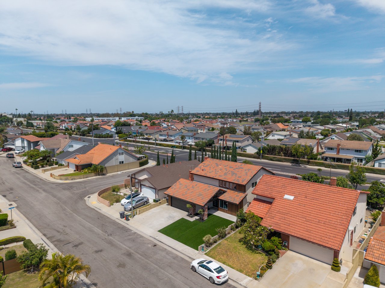 Aerial view of La Palma homes with tiled roofs and residential streets.