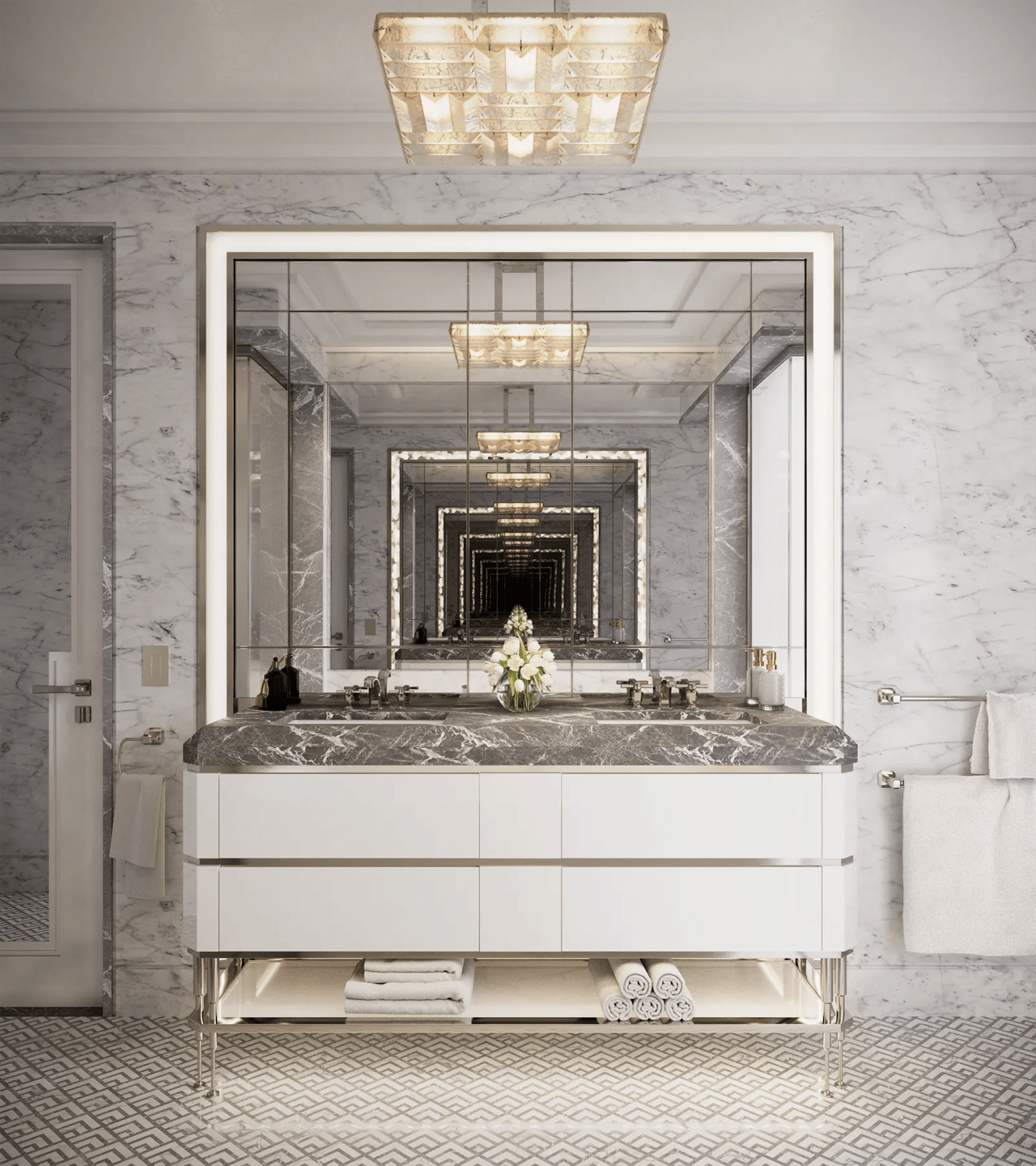 Marble bathroom vanity framed by a large mirror, with white cabinetry and warm pendant lighting.