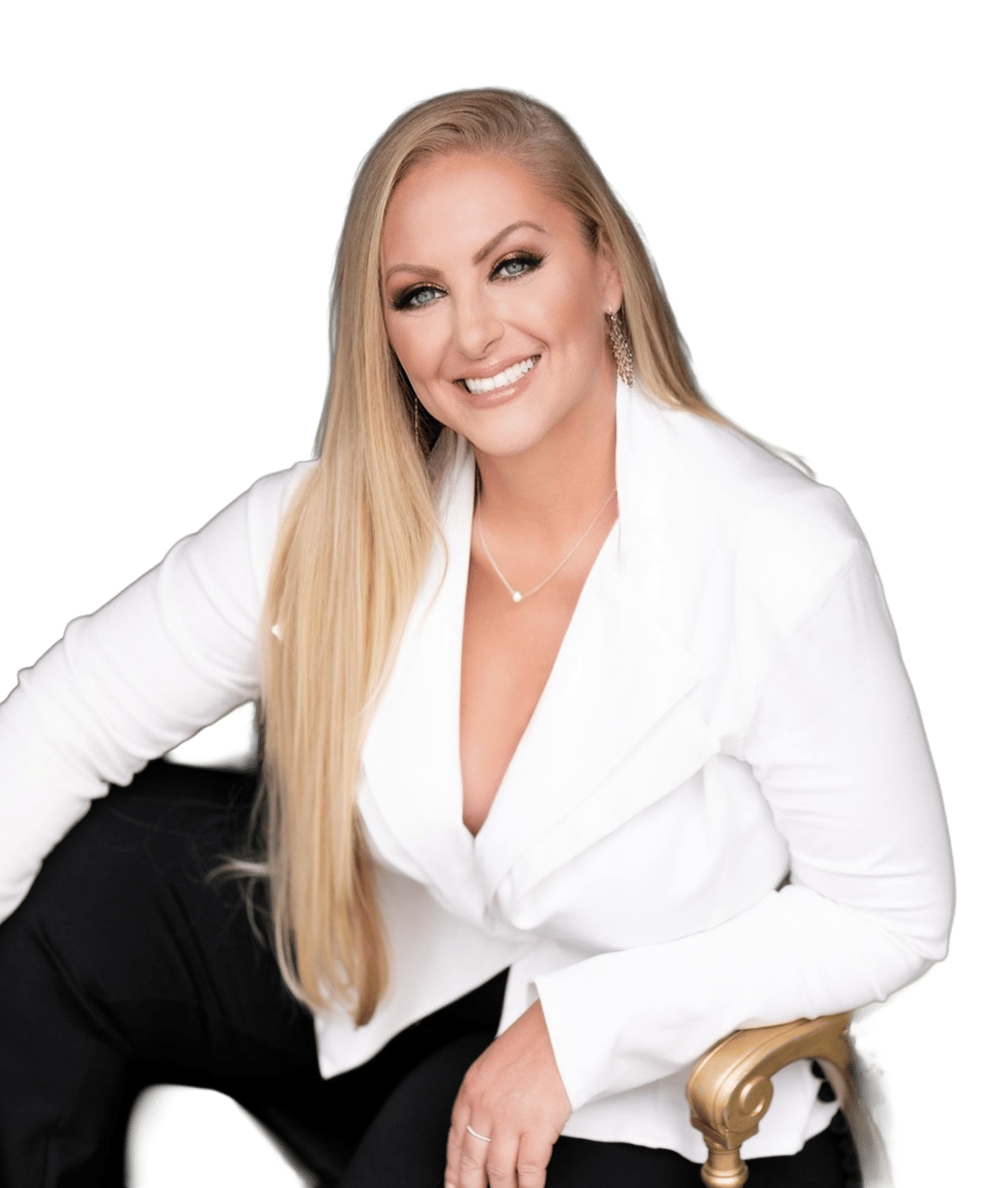Stacy Colledge seated in a white blazer, smiling with long blonde hair.