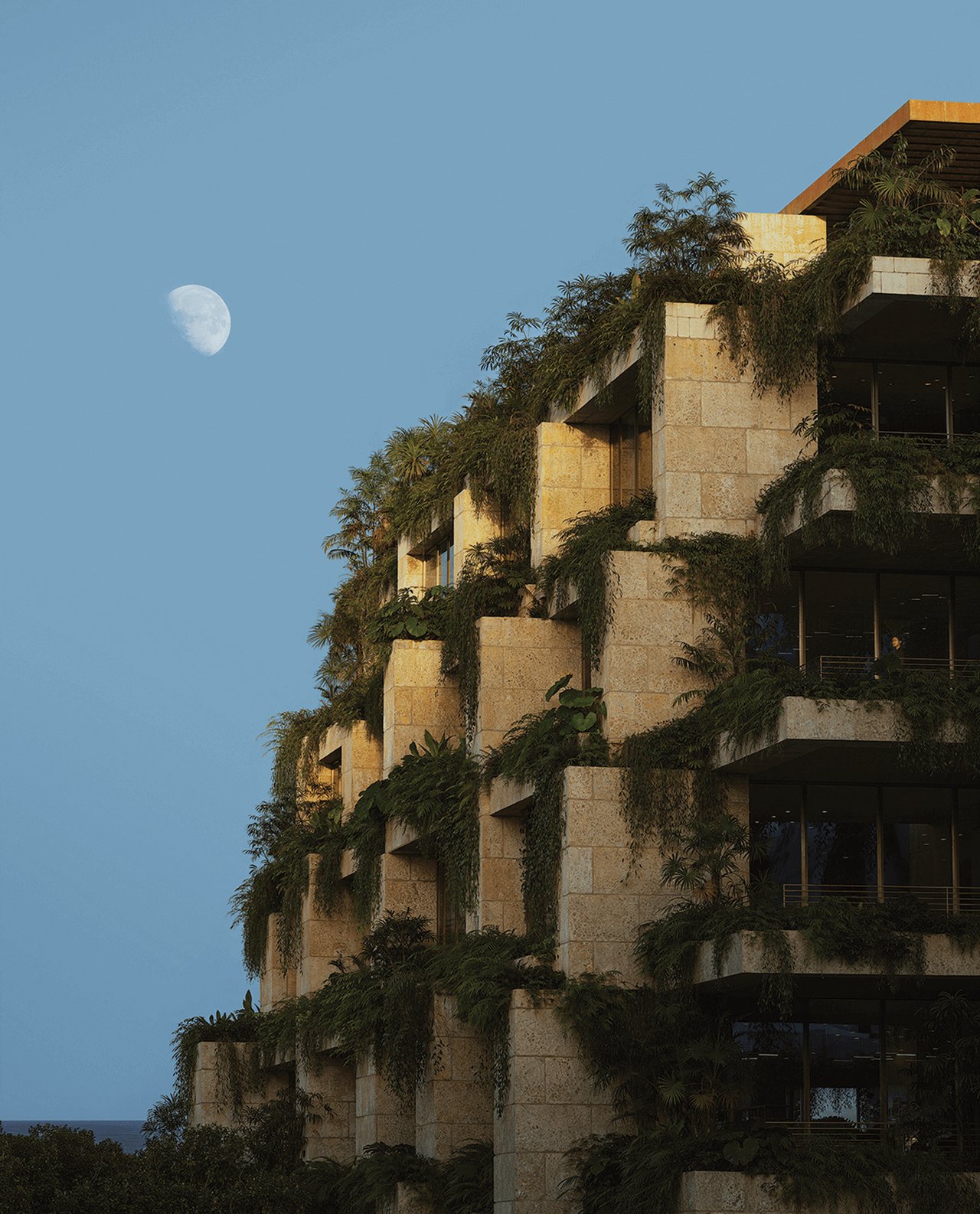 Ziggurat’s stone terraces covered in greenery beneath the moon at dusk.