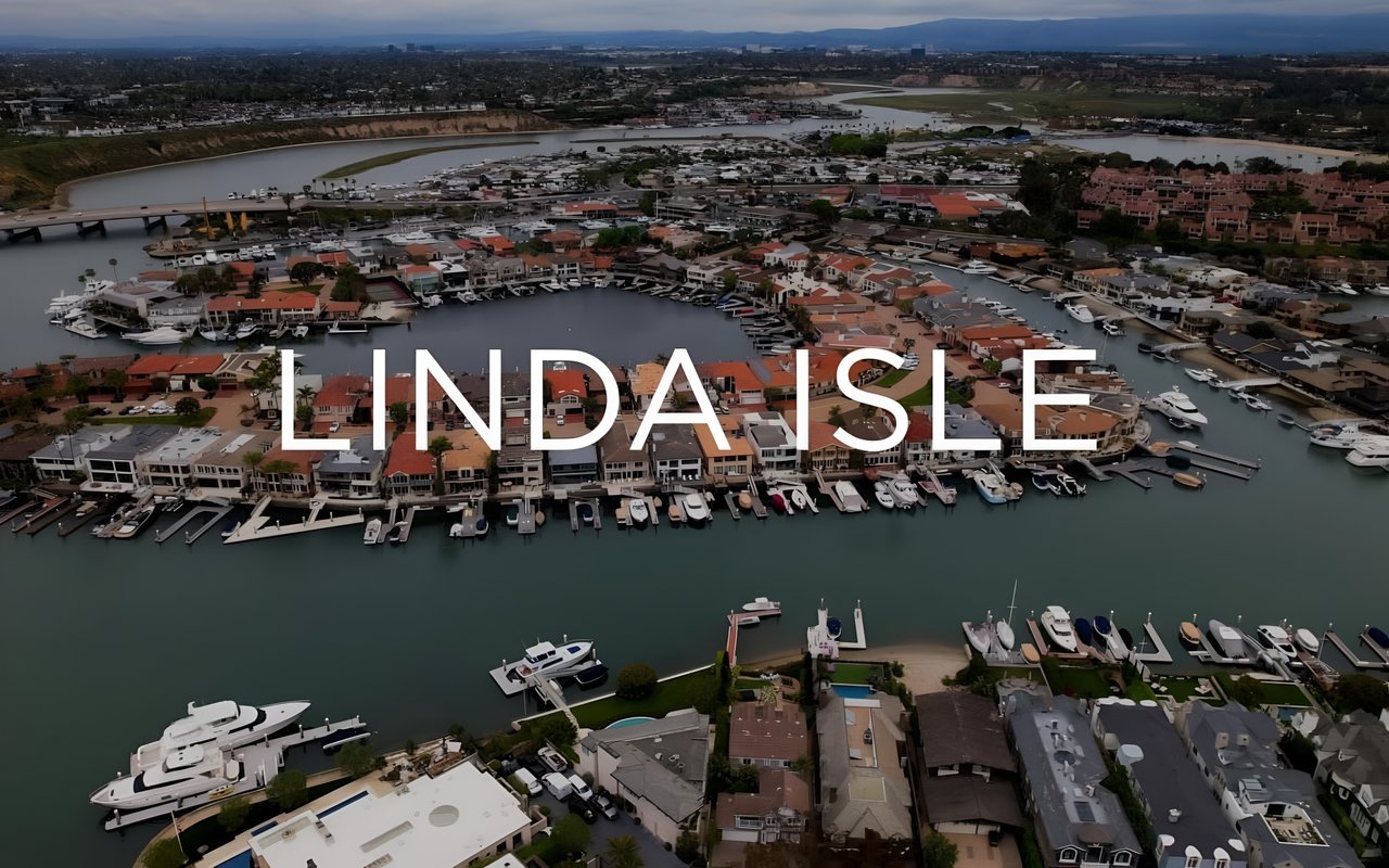 An aerial view of Linda Isle, a neighborhood with luxury homes and boats docked in the canals.