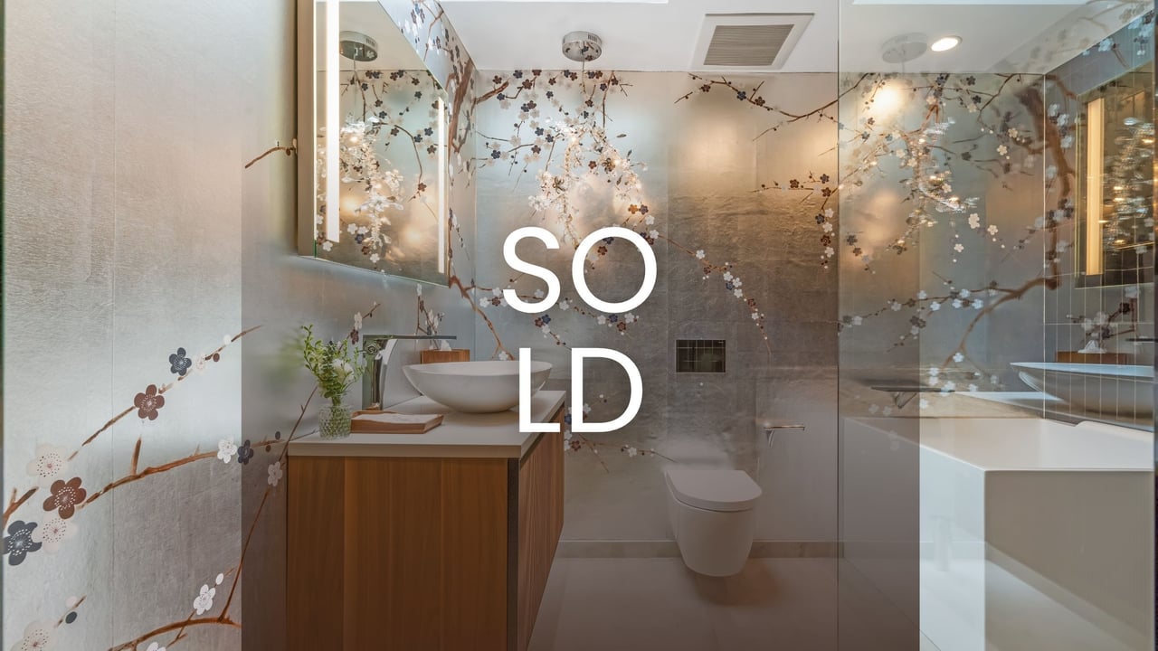 Elegant bathroom with modern fixtures, clean lines, and natural light, showcasing high-end interior design.