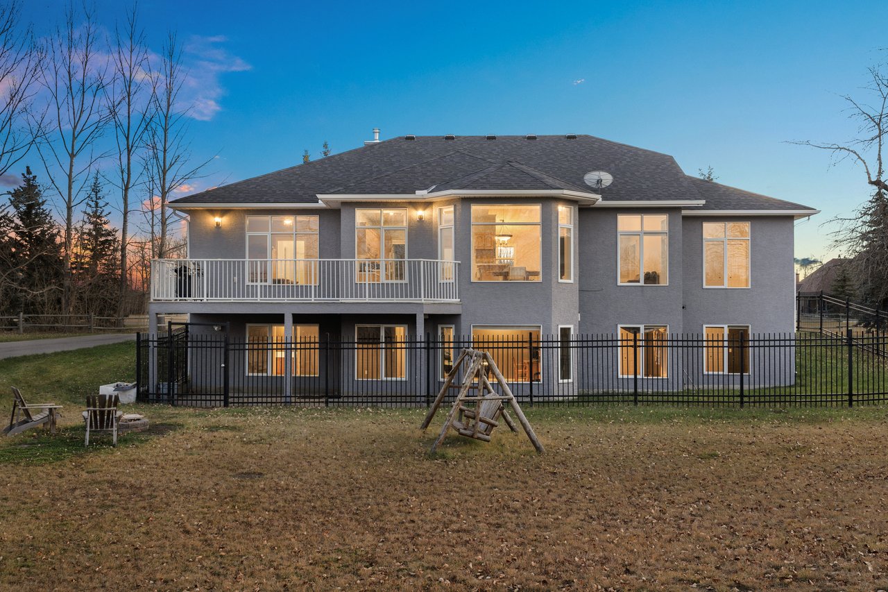 Acreage Living: Walkout Bungalow Backing Onto the Sheep River Reserve