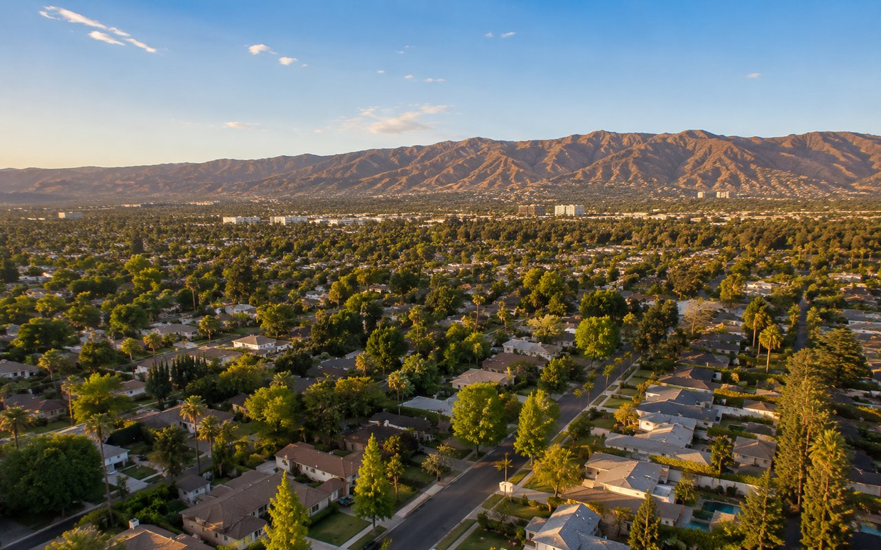 San Fernando Valley residential neighborhood with single-family homes and mountains at sunset
