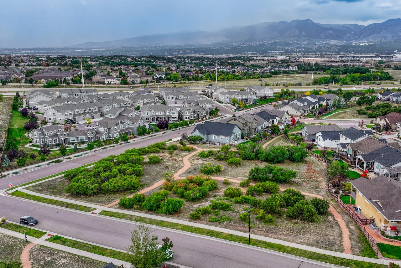 Aerial view of open space trails with mountains in the distance