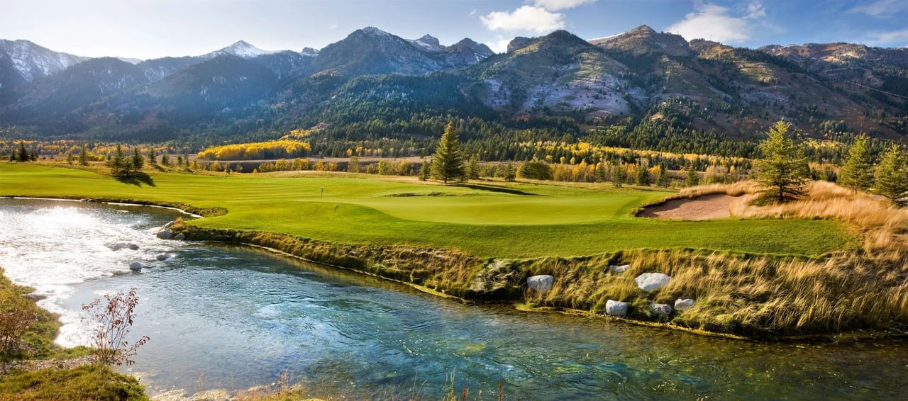 View of luxury homes in the Shooting Star neighborhood in Jackson Hole with scenic Teton Mountains in the background, showcasing exclusive real estate and natural beauty.