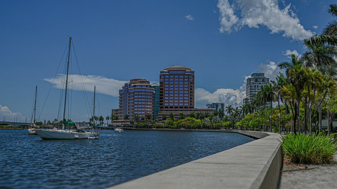 West Palm Beach waterfront with sailboats and downtown towers along the Intracoastal