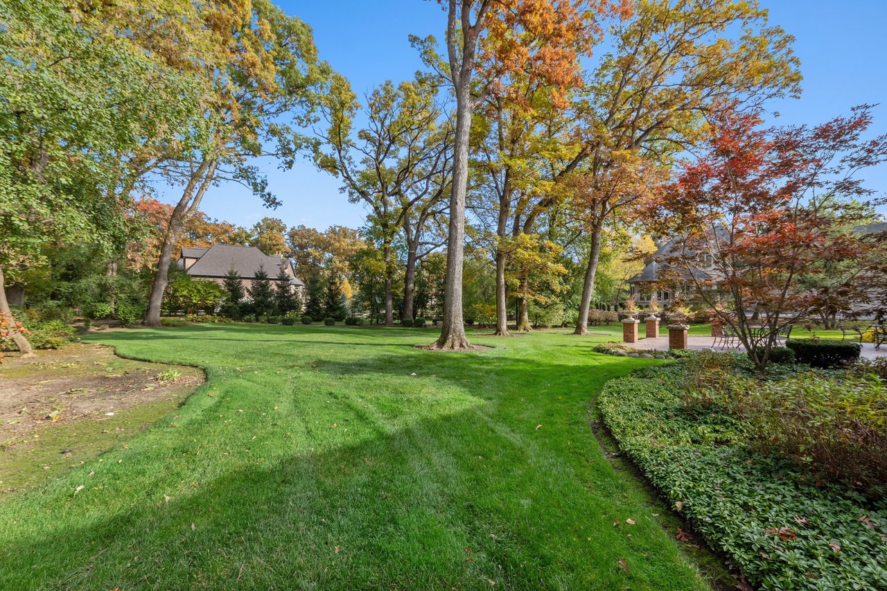 Beautifully Appointed Home in a Gated Community on Over an Acre of Professionally Landscaped Grounds with Pond Views