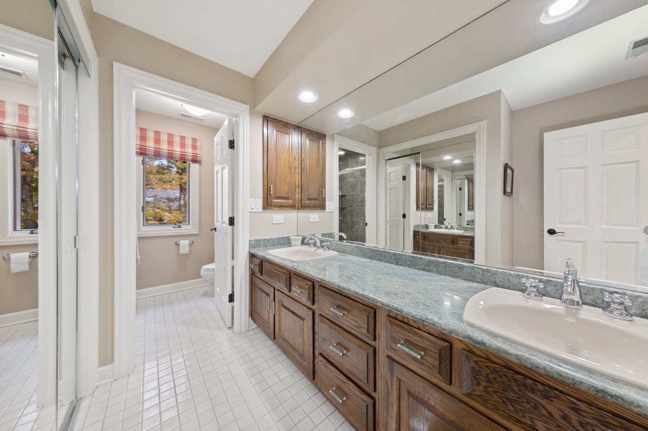 Beautifully Appointed Home in a Gated Community on Over an Acre of Professionally Landscaped Grounds with Pond Views