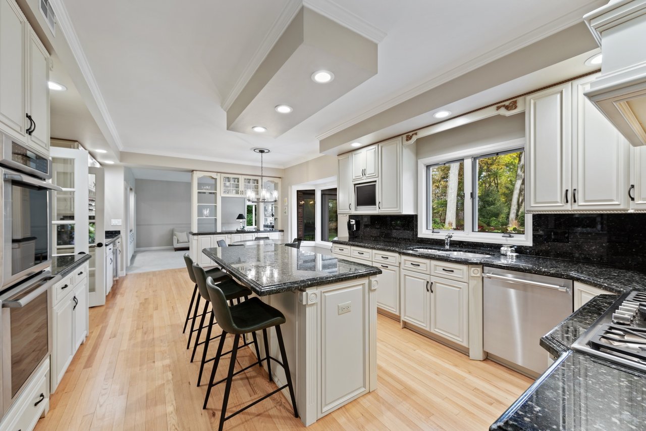 Beautifully Appointed Home in a Gated Community on Over an Acre of Professionally Landscaped Grounds with Pond Views